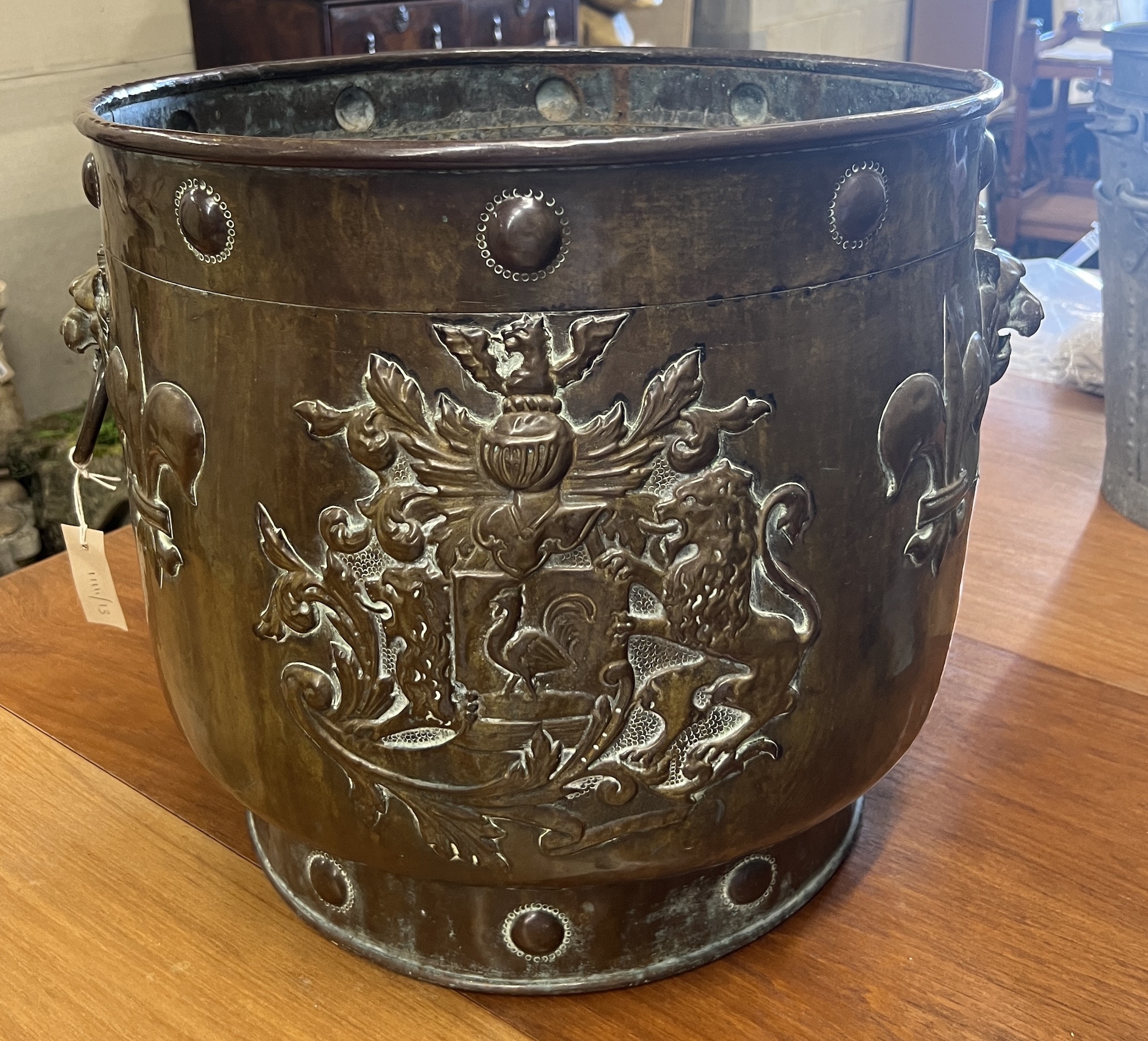 A 19th century Dutch embossed copper coal bin, diameter 49cm, height 45cm